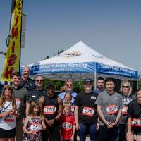 A group photo with many of the racers.